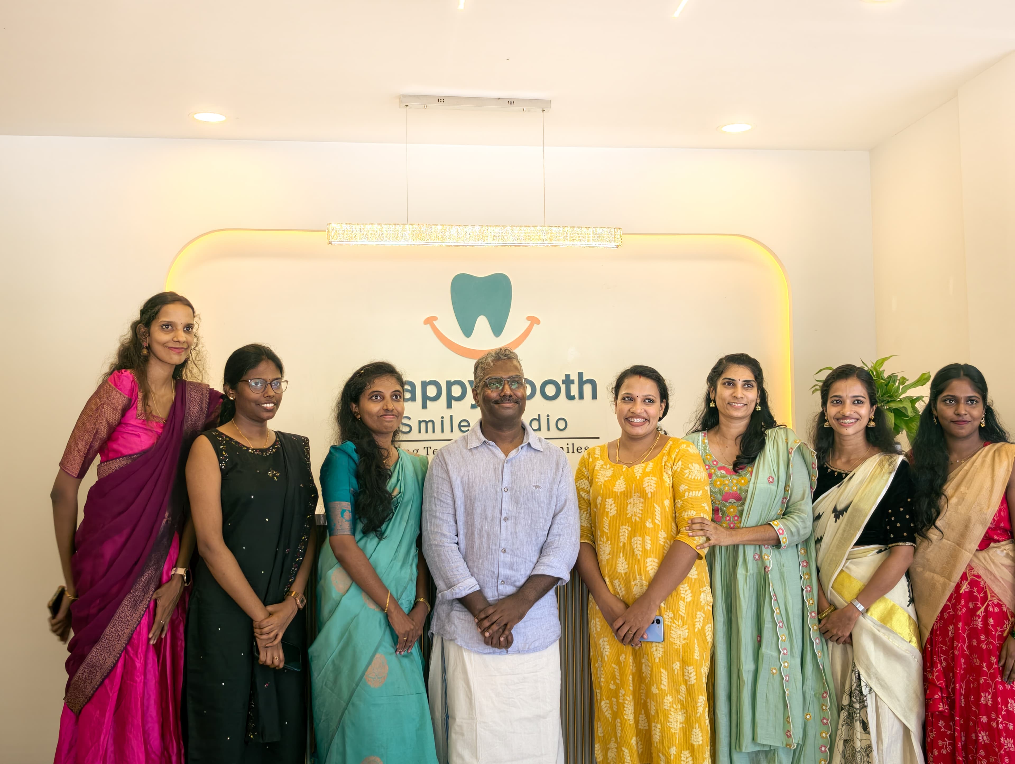 Happy Indian family smiling with healthy teeth